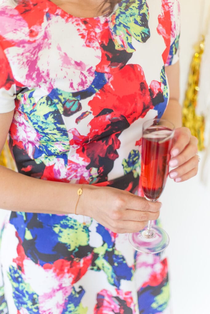 hand holding a kir royale cocktail
