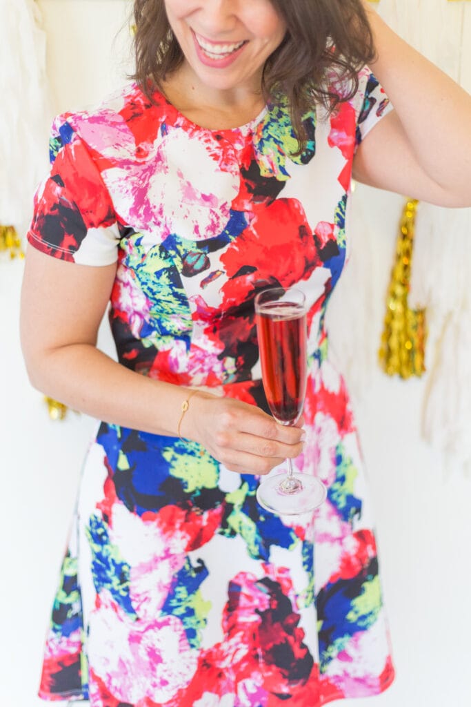 hand holding a kir royale cocktail