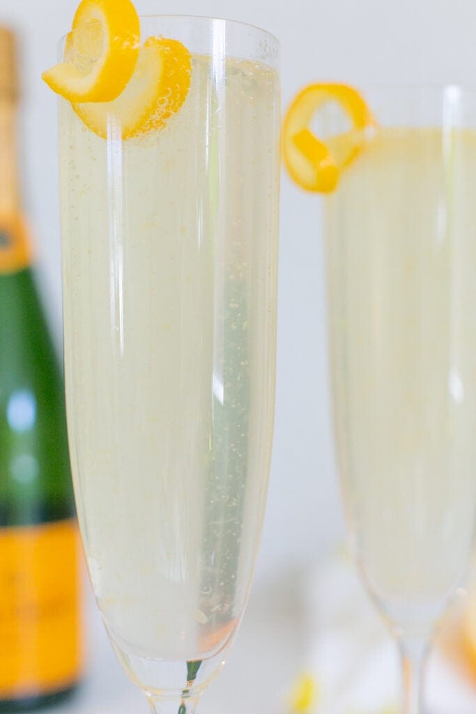 French 75 cocktail close up with lemon twist