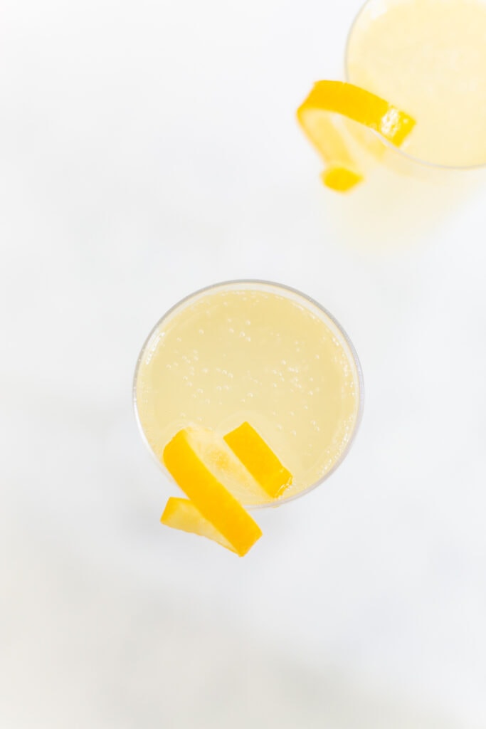 French 75 cocktail close up with lemon twist