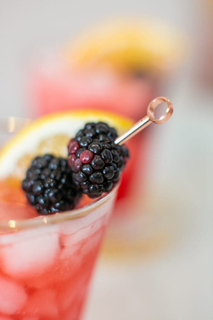 closeup of blackberries in a cocktail