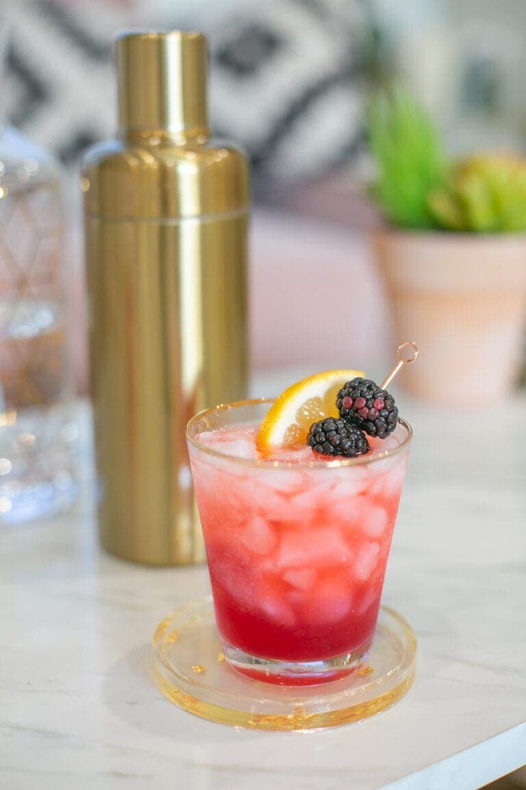 Easter cocktail blackberry bramble on a coaster
