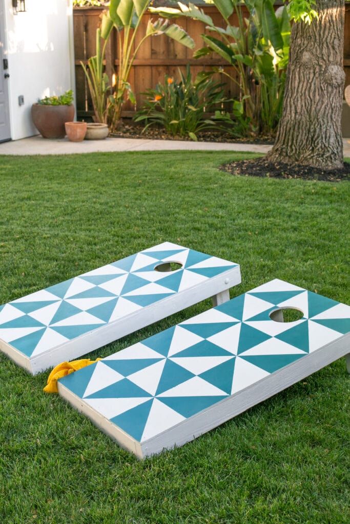 cornhole board on grass