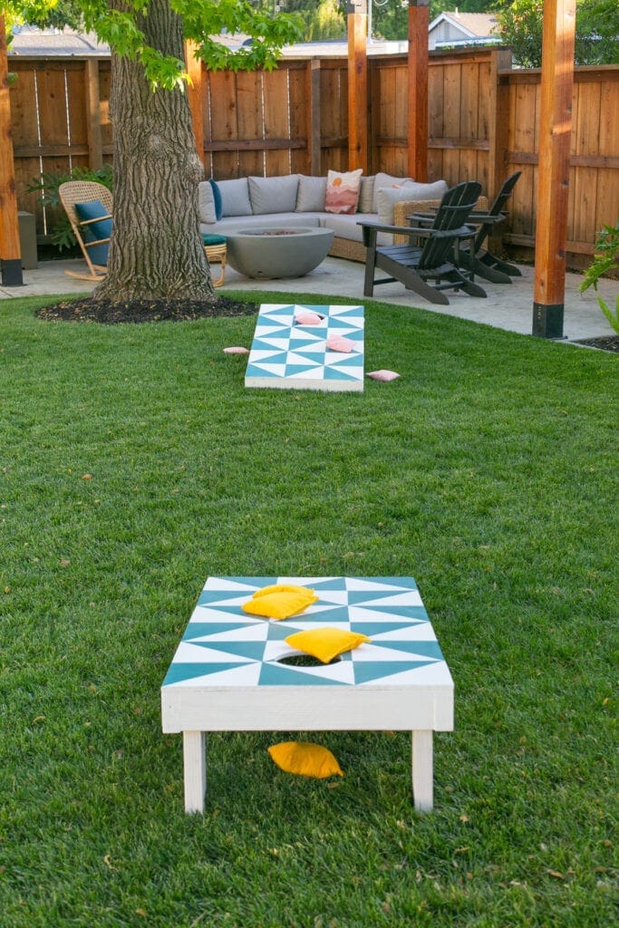 cornhole board on grass