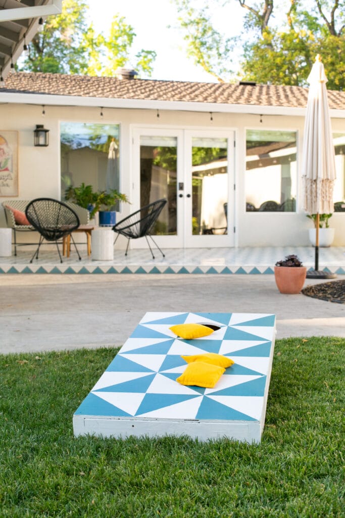 cornhole board on grass