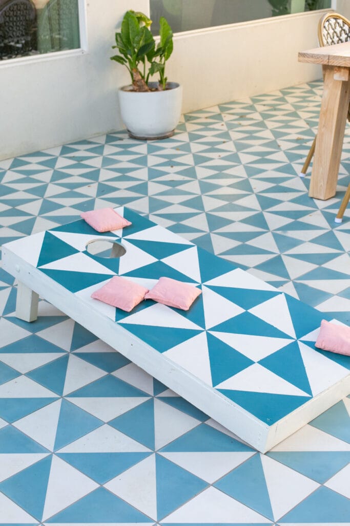 cornhole board on a patio
