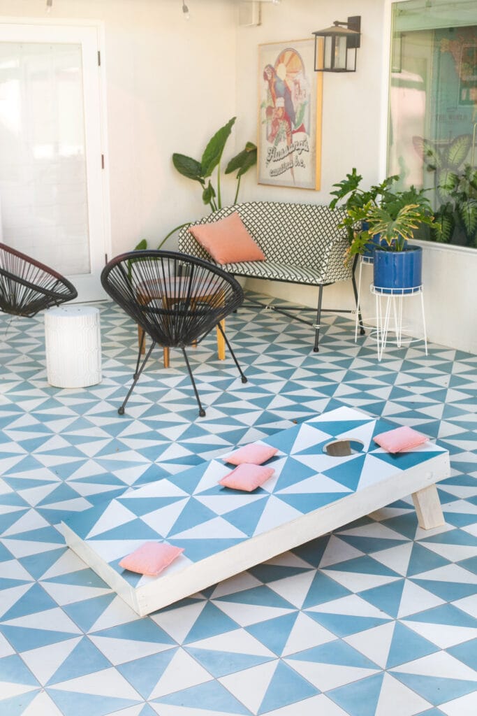 cornhole board on a patio