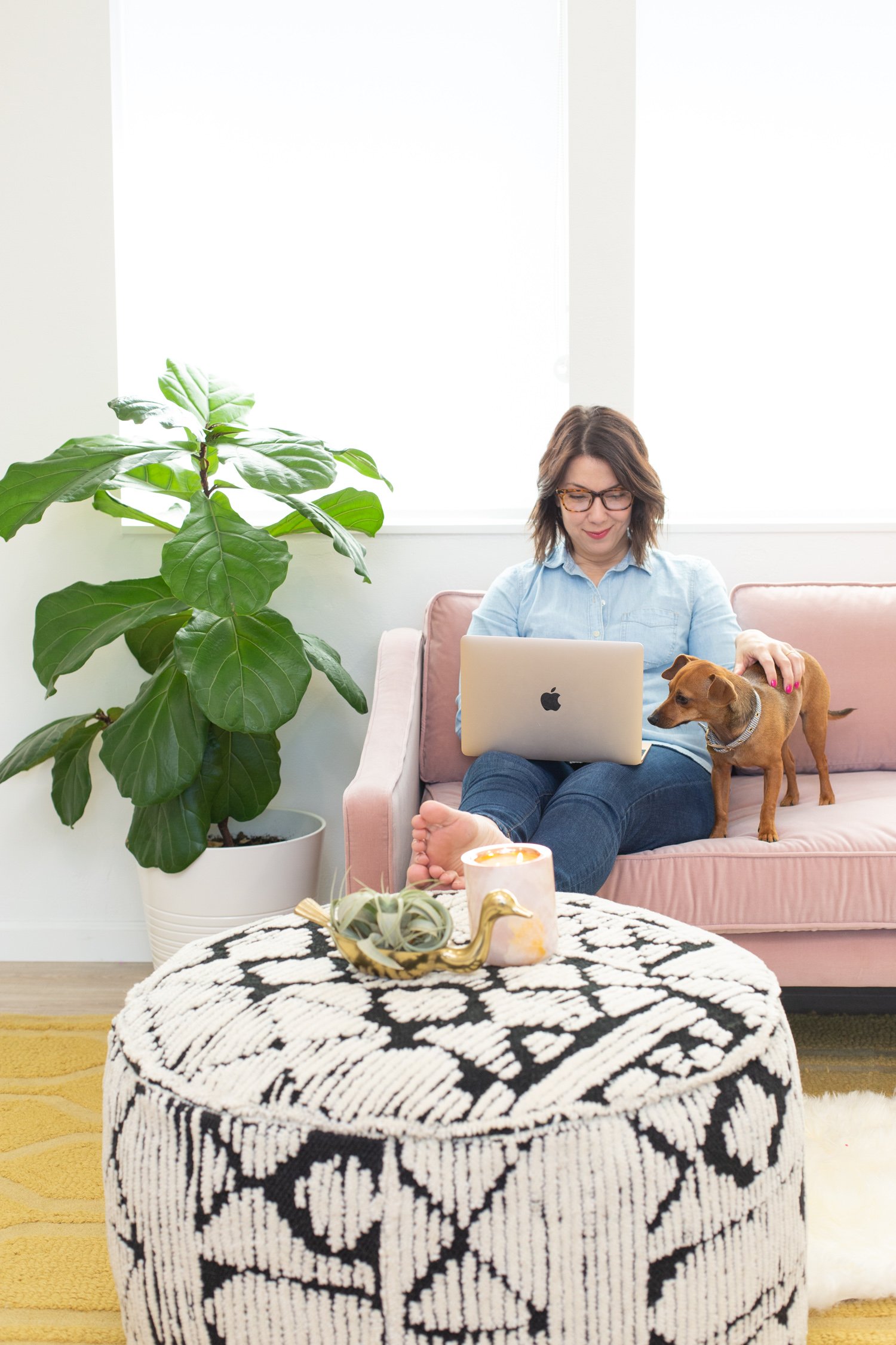 Pink sofa seating area in a home office