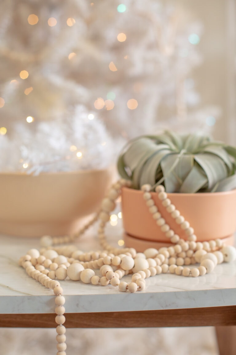 wooden beads on a table with christmas decor