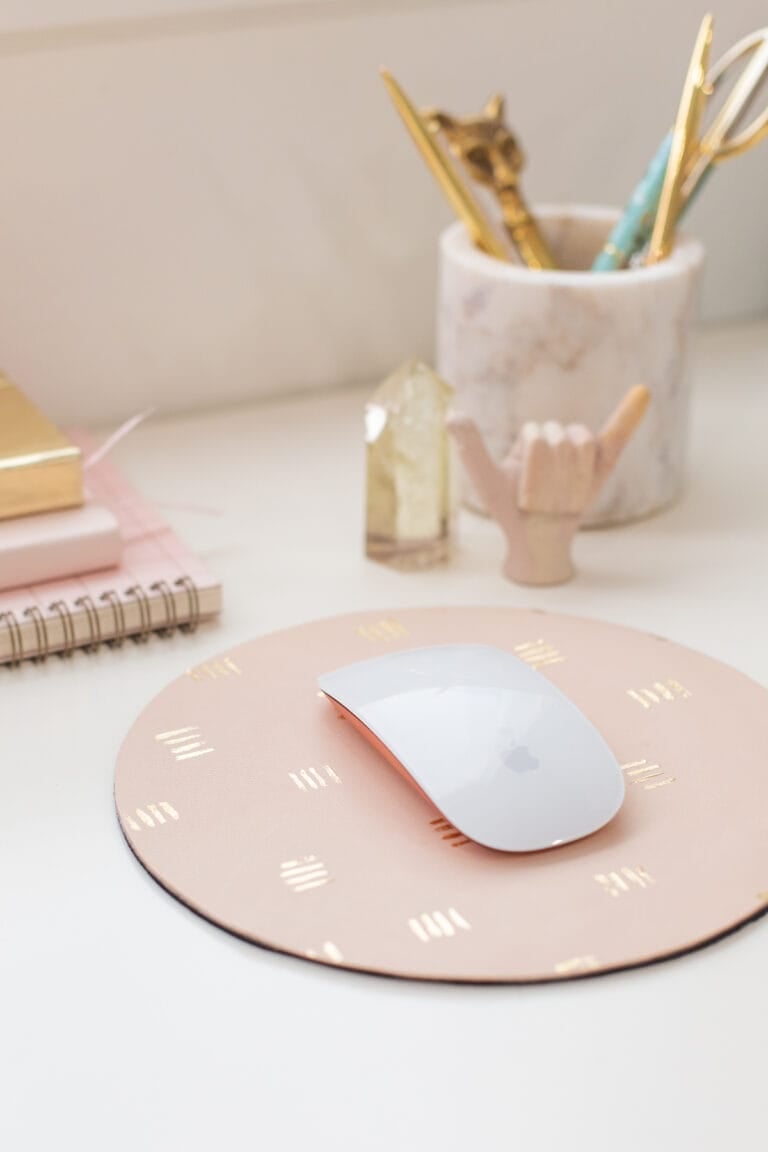 mouse pad on desk with supplies