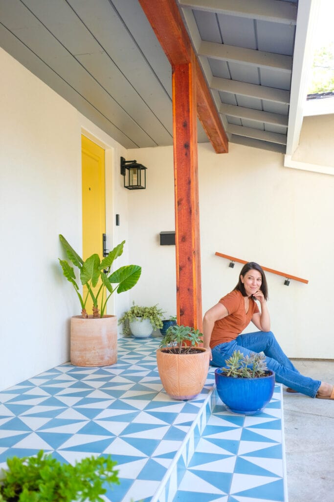 tile front porch with woman sitting