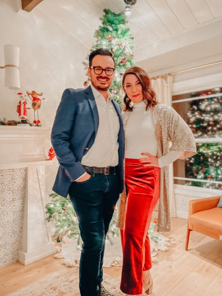 couple in front of a christmas tree