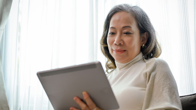 Older woman using ipad