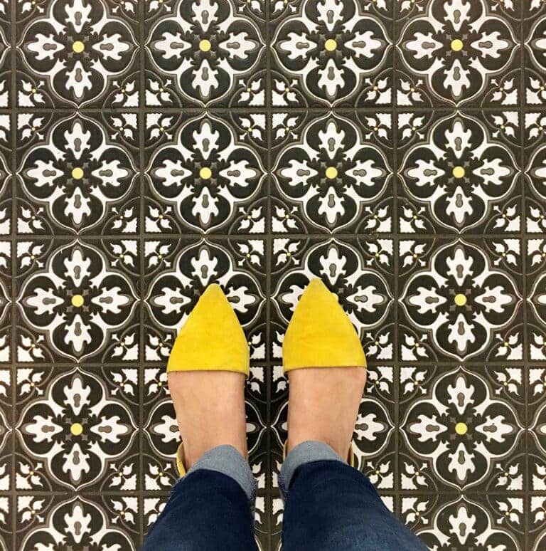 Pattern tile with feet and yellow shoes